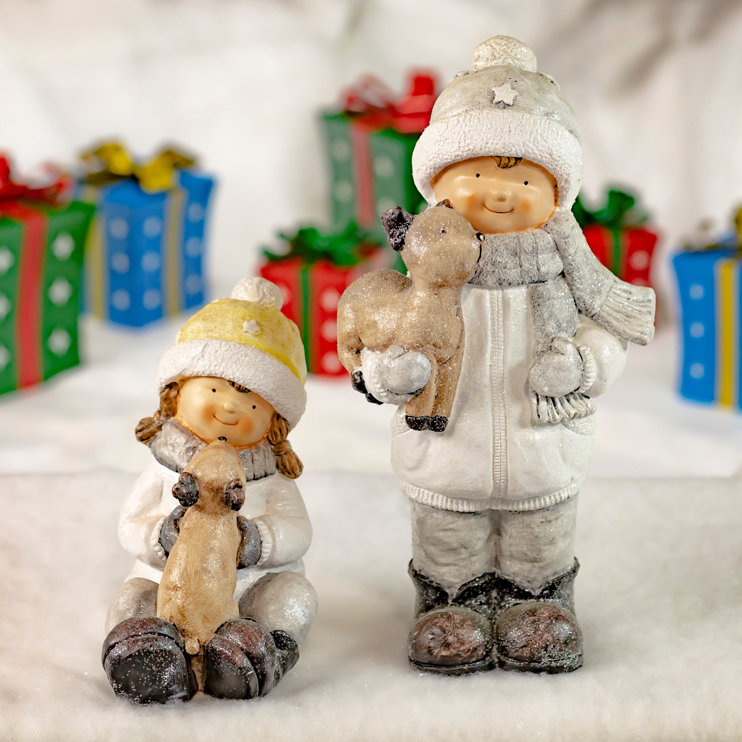 Zaer Ltd. International Set of 2 Tushka Snow Children in White Holding Baby Reindeer ZR960380