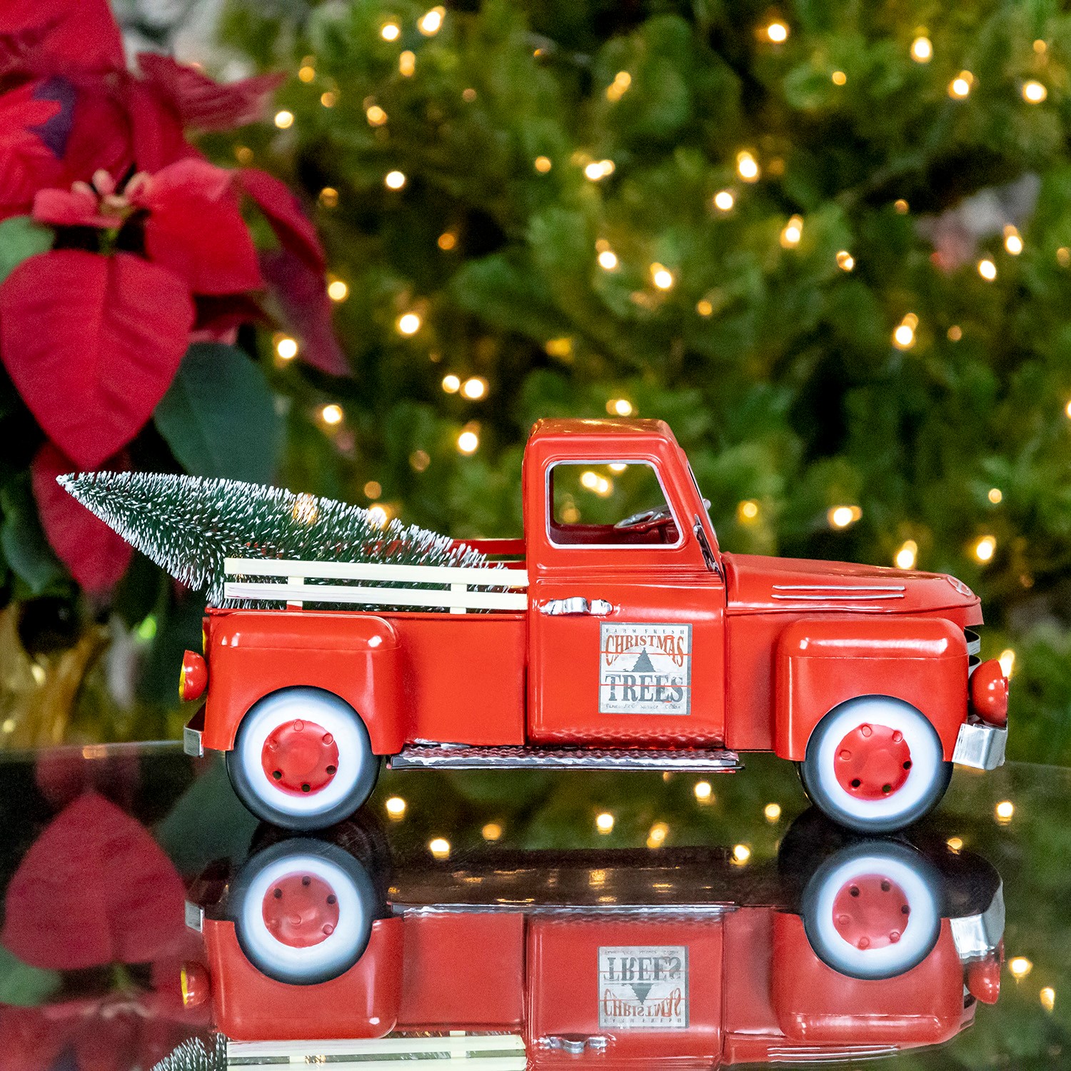 Red metal truck shop with christmas tree